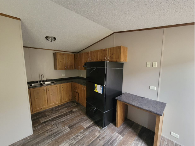 Full kitchen with wood cabinets